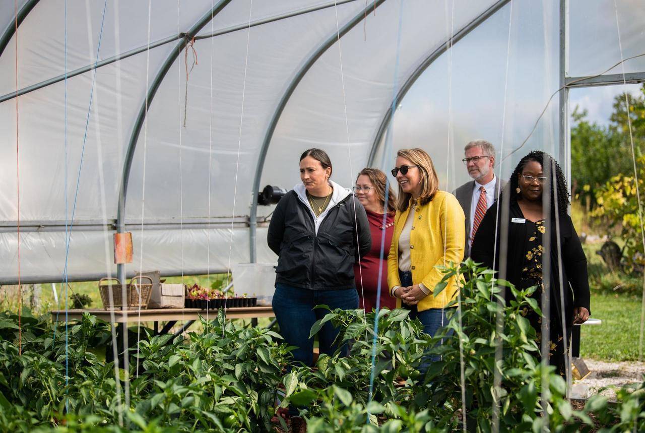 group touring a greenhouse